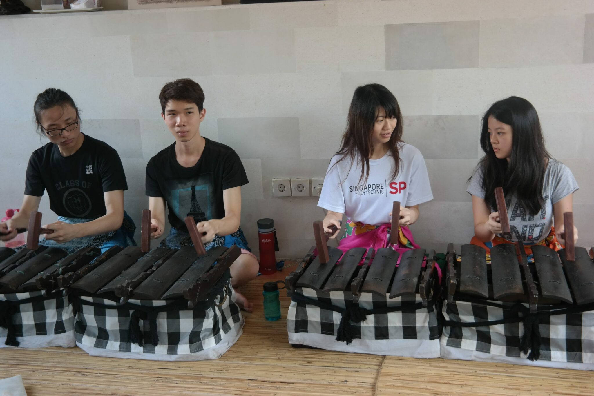 four students at gangsa, workshop